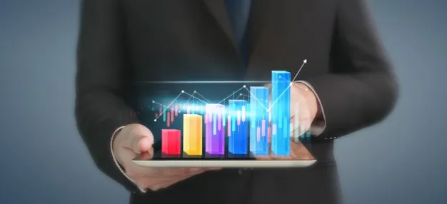 Business plan graph growth and increase of chart positive indicators in his business, tablet in hand Premium Photo"