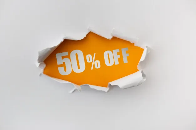 A torn hole in the white wall of paper on a yellow background