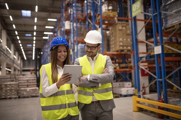  “Managers controlling distribution and checking inventory in warehouse storage”

