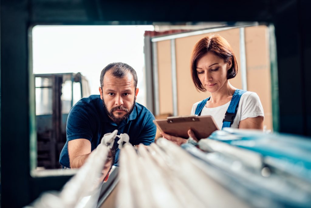 ”Stock clerk checking warehouse inventory”