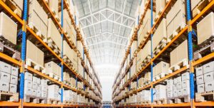 "Rows of shelves with boxes in modern warehouse Premium Photo"