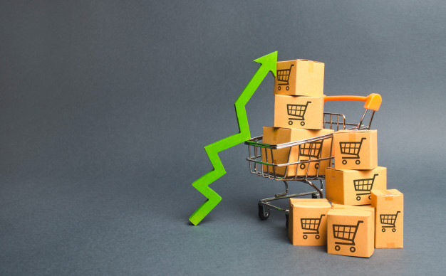 "Shopping cart with cardboard boxes with a pattern of trading carts and a green up arrow Premium Photo"