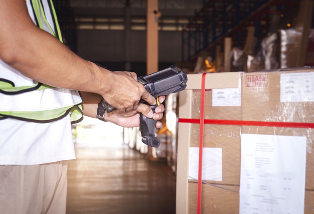 Warehouse worker using barcode inventory software